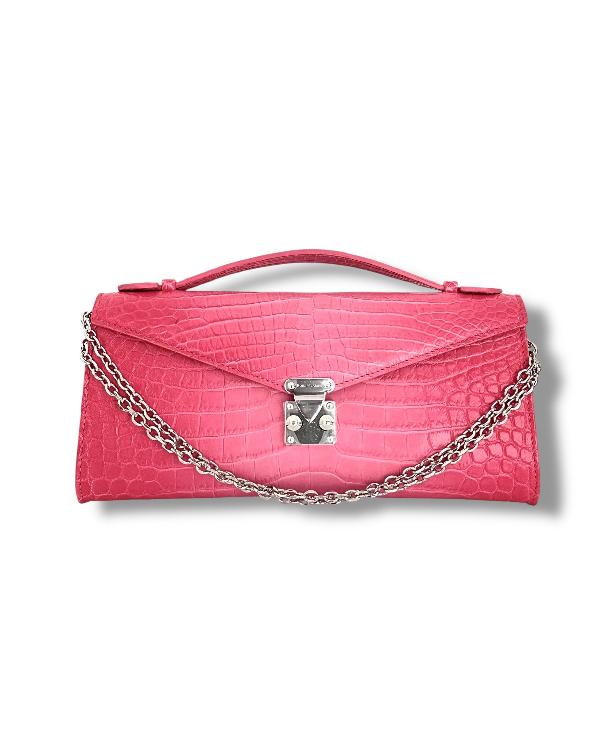 NAMED AFTER ROBERT’S OLDEST DAUGHTER, AFFECTIONATELY CALLED “MINNIE,” THIS CHIC ACCESSORY SEAMLESSLY TRANSITIONS FROM A DAY OF SHOPPING TO AN ELEGANT EVENING OUT. WITH PERFECTLY CRAFTED DIMENSIONS, THE MINNIE POCHETTE HOLDS ALL YOUR ESSENTIALS—PHONE, KEYS, WALLET, AND MORE—WHILE MAINTAINING A SLEEK AND REFINED SILHOUETTE. DESIGNED FOR VERSATILITY, IT FEATURES A TOP HANDLE FOR CLASSIC ELEGANCE AND A JEWELRY-LIKE CHAIN THAT ALLOWS IT TO BE CARRIED AS A CLUTCH, A SHOULDER BAG, OR A CROSSBODY.