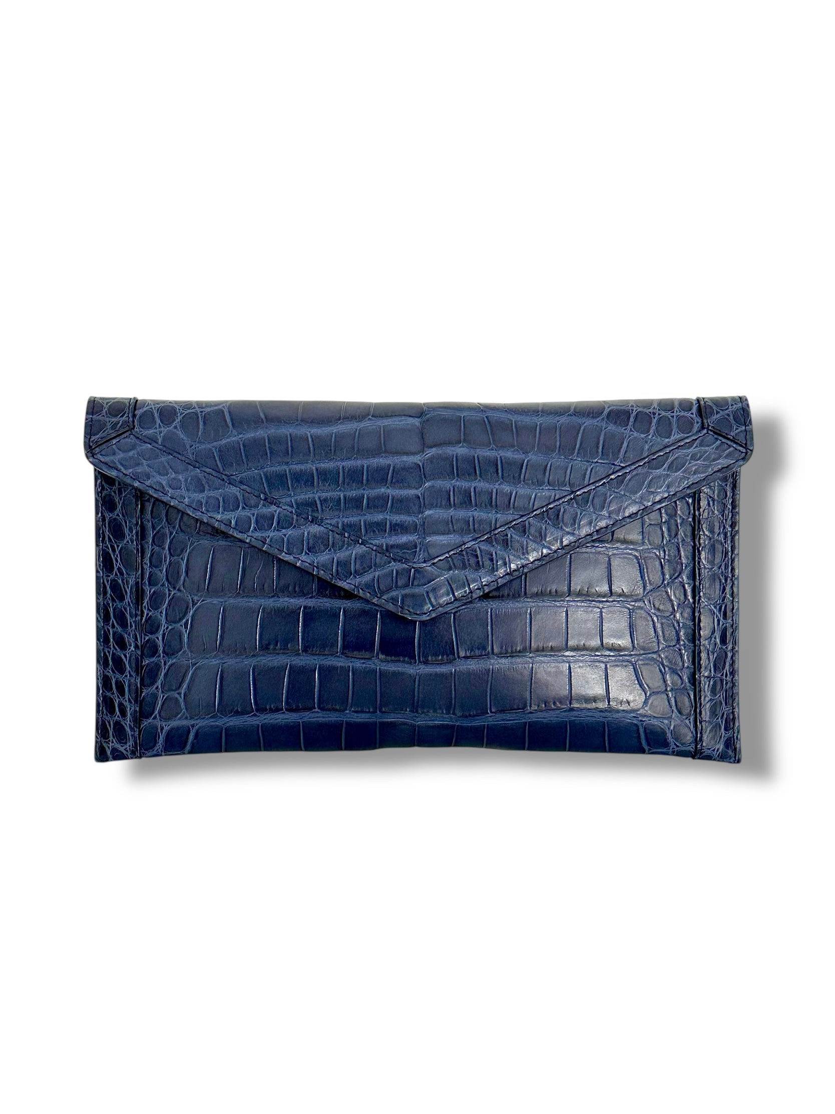 The Morgan clutch is the embodiment of effortless elegance—crafted for the woman who values simplicity without sacrificing luxury. Streamlined yet versatile, its silhouette is large enough to hold your phone and essentials, making it the perfect companion for a day of errands, an evening soirée, or a night on the town.