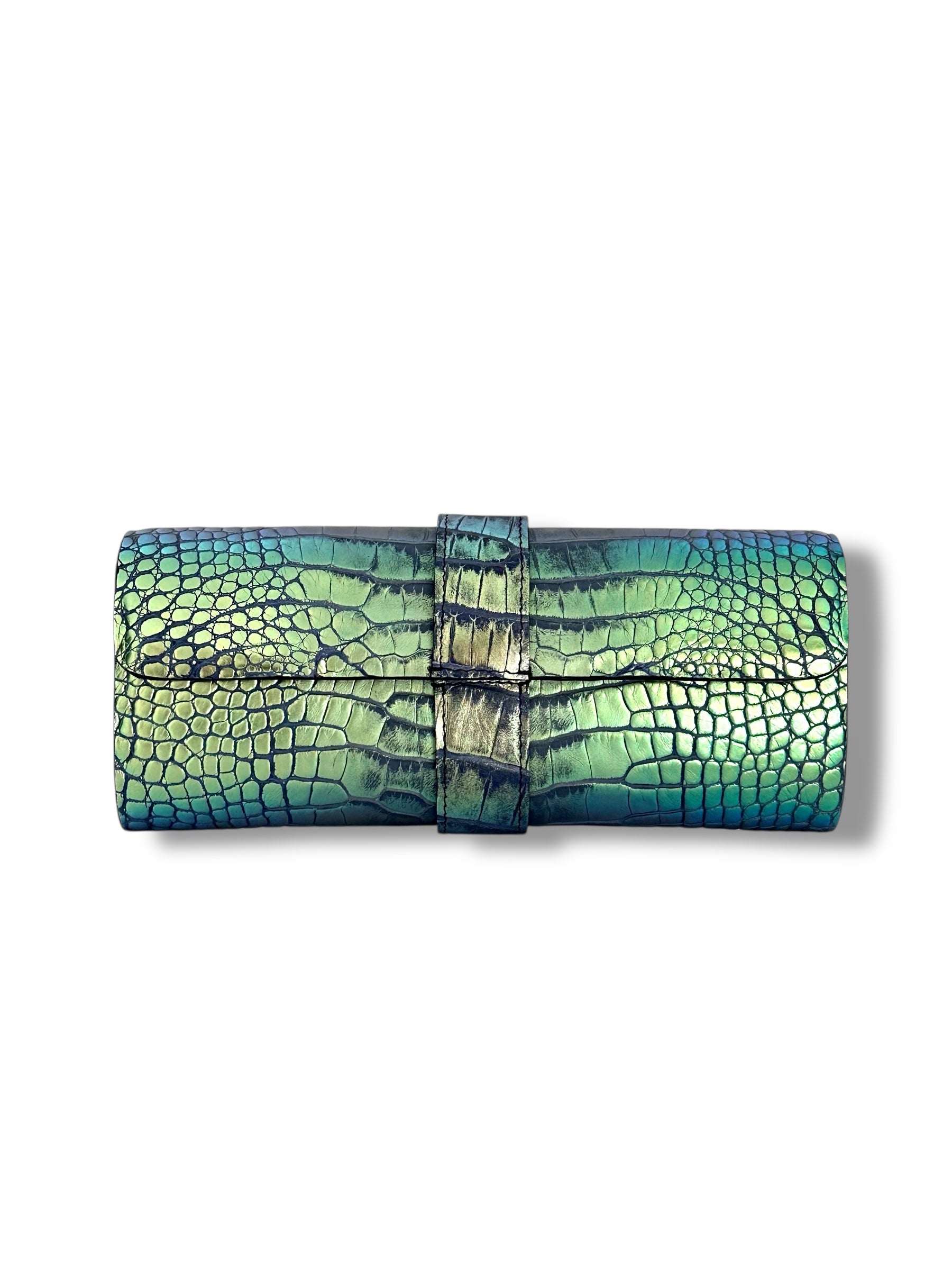 The Valerie clutch is the definition of understated sophistication—crafted with clean lines, refined structure, and a beautifully simple strap that wraps gracefully around the center, adding an element of quiet luxury. Designed as the perfect evening companion, it balances classic allure with contemporary chic.